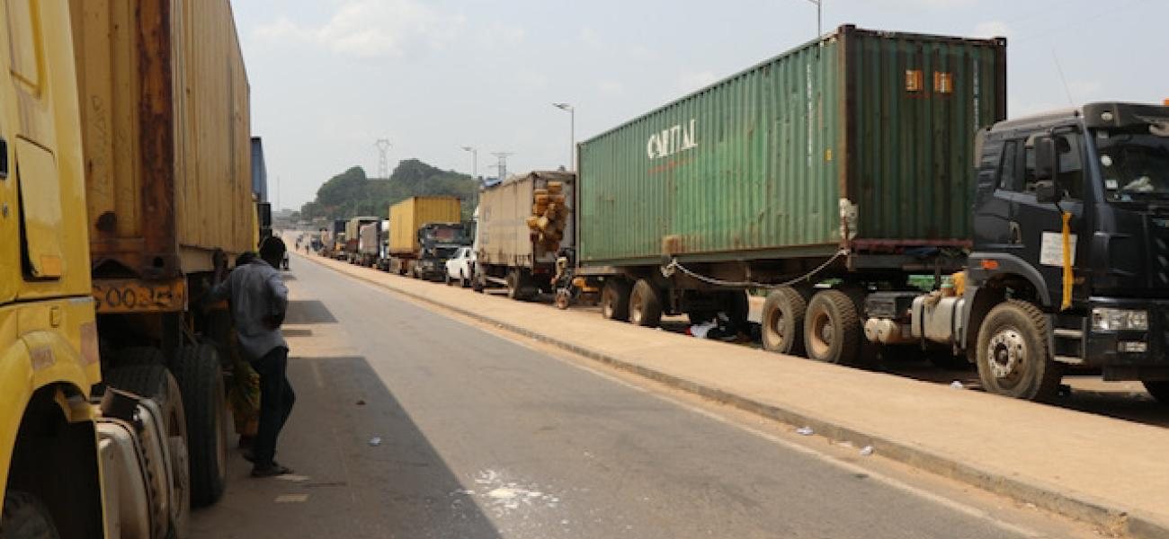 Trucks queued along a West African corridor